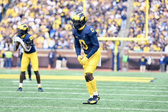 Rod Moore (19) and Mike Sainristil (0)