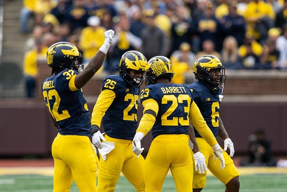 Jaylen Harrell (32), Junior Colson (25), Michael Barrett (23), and R.J. Moten (6)
