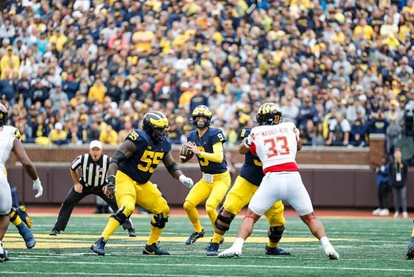 Olusegun Oluwatimi (55), J.J. McCarthy (9), and Giovanni El-Hadi (58)