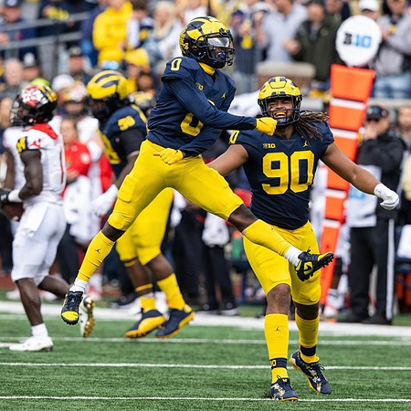 Mazi Smith (58), Mike Sainristil (0), and Mike Morris (90)