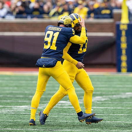 Brad Robbins (91) and Jake Moody (13)