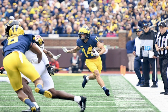 Ronnie Bell (8) and Roman Wilson (14)