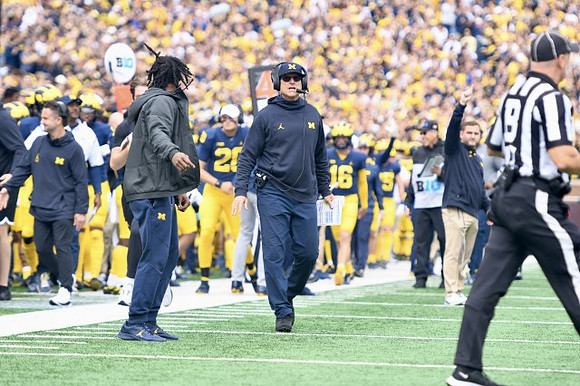 Donovan Edwards (7), Jim Harbaugh, and Michigan Team