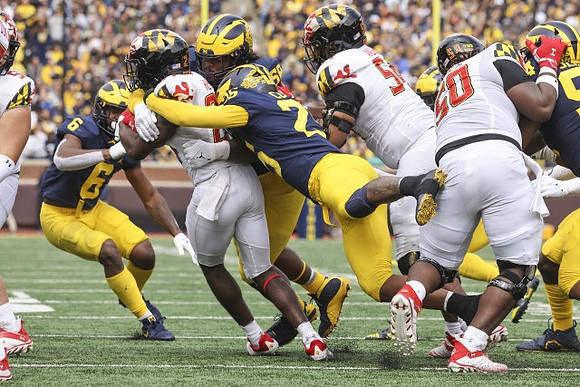 R.J. Moten (6), Junior Colson (25), and Mazi Smith (58)