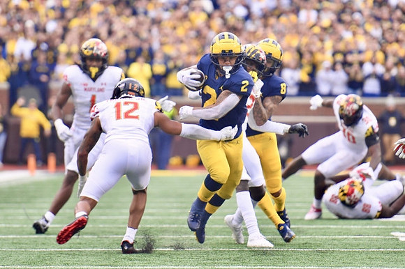Blake Corum (2) and Ronnie Bell (8)