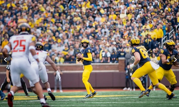 J.J. McCarthy (9) and Luke Schoonmaker (86)