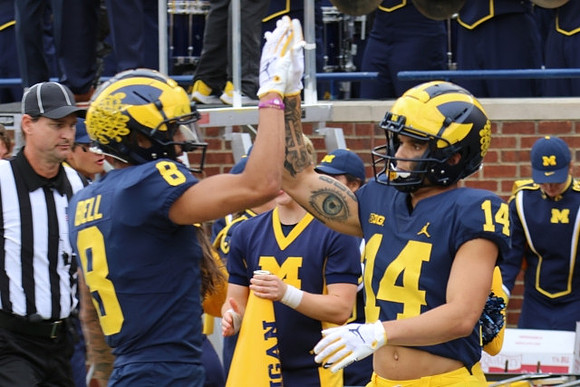 Ronnie Bell (8) and Roman Wilson (14)