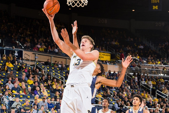 Moritz Wagner (13) and Derrick Walton Jr. (10)