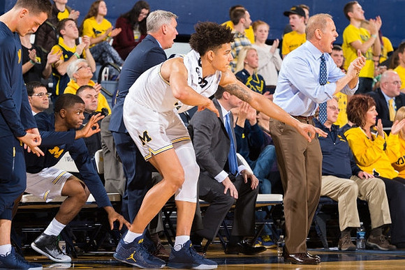 Xavier Simpson (3), Jeff Meyer, D.J. Wilson (5), and John Beilein