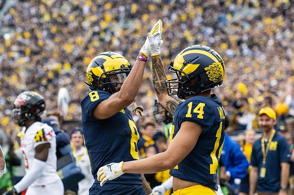 Ronnie Bell (8) and Roman Wilson (14)
