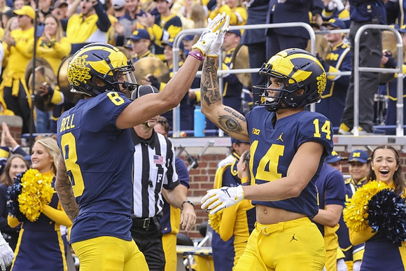 Ronnie Bell (8) and Roman Wilson (14)
