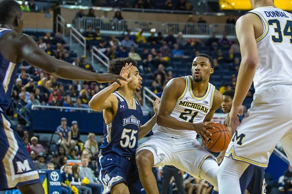 Zak Irvin (21) and Mark Donnal (34)