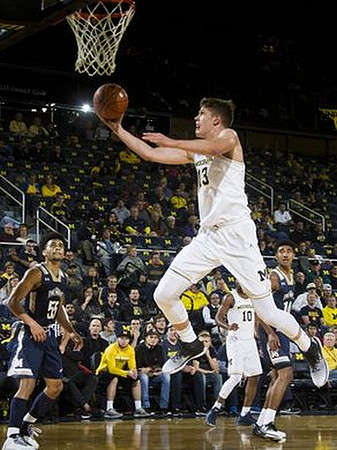 Moritz Wagner (13) and Derrick Walton Jr. (10)
