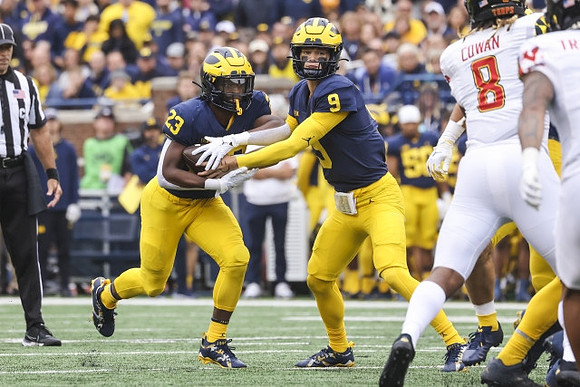 CJ Stokes (23) and J.J. McCarthy (9)