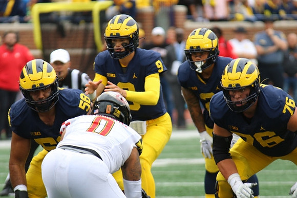 Giovanni El-Hadi (58), J.J. McCarthy (9), Blake Corum (2), and Ryan Hayes (76)