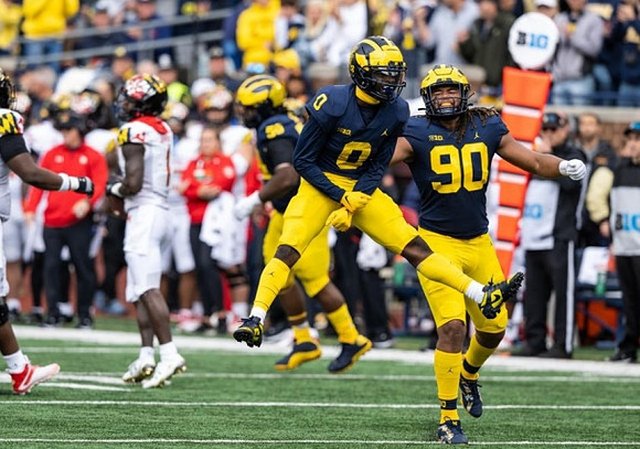 Mazi Smith (58), Mike Sainristil (0), and Mike Morris (90)