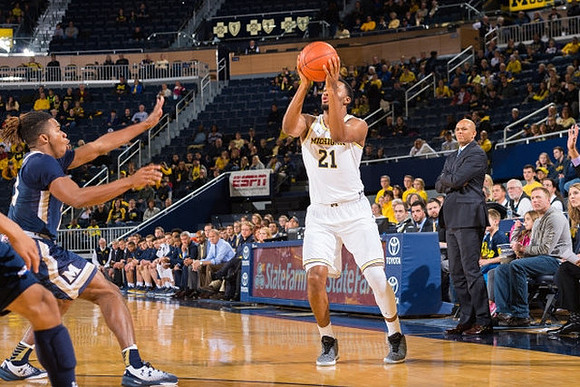 Zak Irvin (21) and Mount St. Mary's Head Coach Jamion Christian