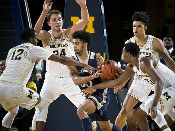 Muhammad-Ali Abdur-Rahkman (12), Mark Donnal (34), Zak Irvin (21), and D.J. Wilson (5)