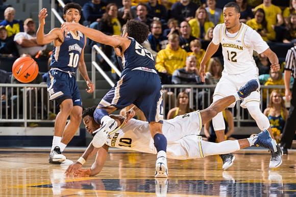 Derrick Walton Jr. (10) and Muhammad-Ali Abdur-Rahkman (12)