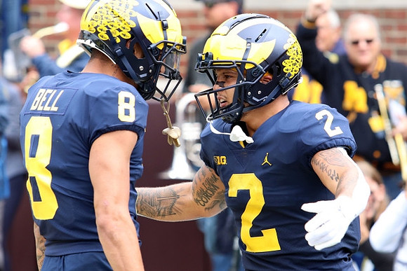 Ronnie Bell (8) and Blake Corum (2)