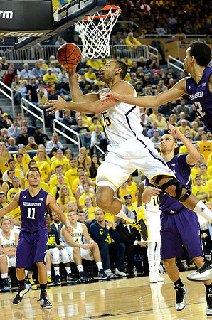 Jon Horford (15) and Tim Hardaway Jr. (10)