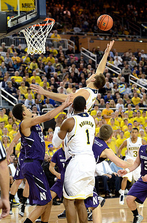 Glenn Robinson III (1), Mitch McGary (4), and Trey Burke (3)