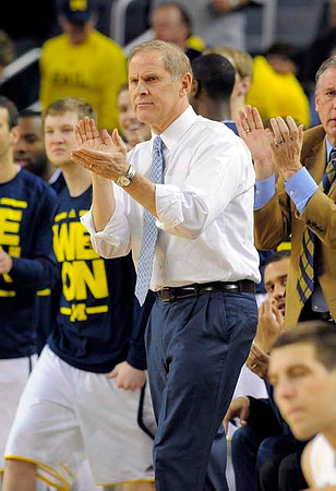 Matt Vogrich (13), John Beilein, and Mitch McGary (4)