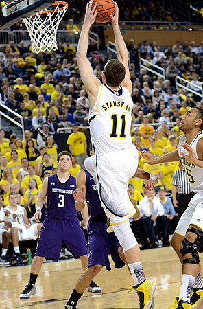 Nik Stauskas (11) and Jon Horford (15)