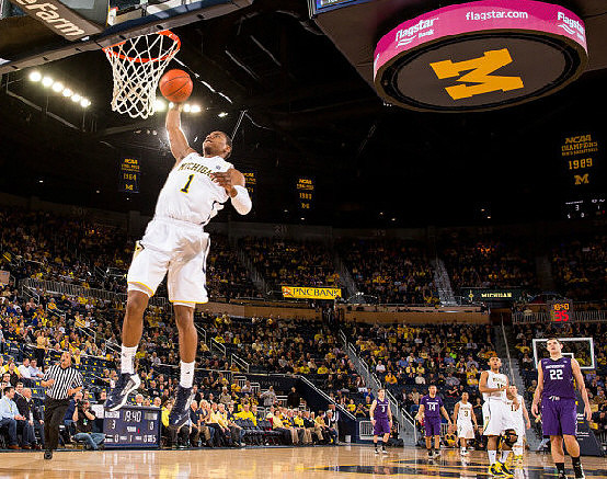 Glenn Robinson III (1), Jon Horford (15), and Trey Burke (3)