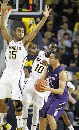 Jon Horford (15) and Tim Hardaway Jr. (10)