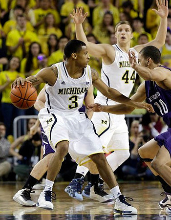 Trey Burke (3) and Max Bielfeldt (44)