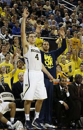 Mitch McGary (4) and Jordan Morgan (52)