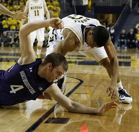 Trey Burke (3) and Nik Stauskas (11)