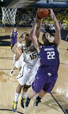 Jon Horford (15) and Trey Burke (3)