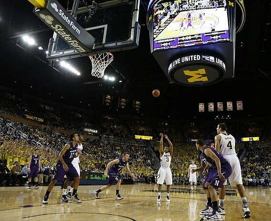 Trey Burke (3) and Mitch McGary (4)