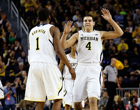 Glenn Robinson III (1) and Mitch McGary (4)