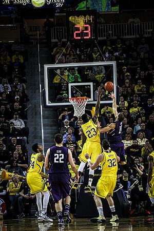 Aubrey Dawkins (24), Caris LeVert (23), and Ricky Doyle (32)