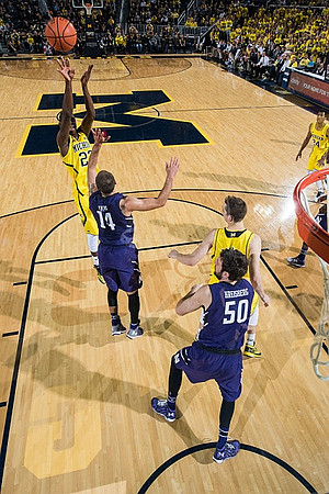Caris LeVert (23), Mark Donnal (34), and Aubrey Dawkins (24)