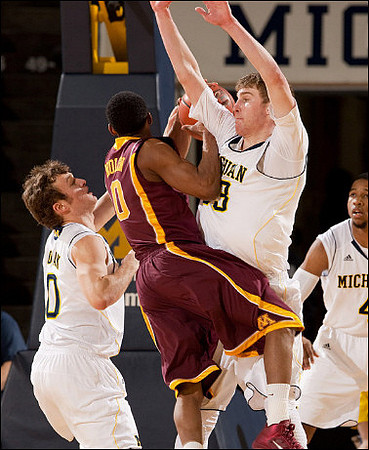 Zack Novak (0), Evan Smotrycz (23), and Darius Morris (4)