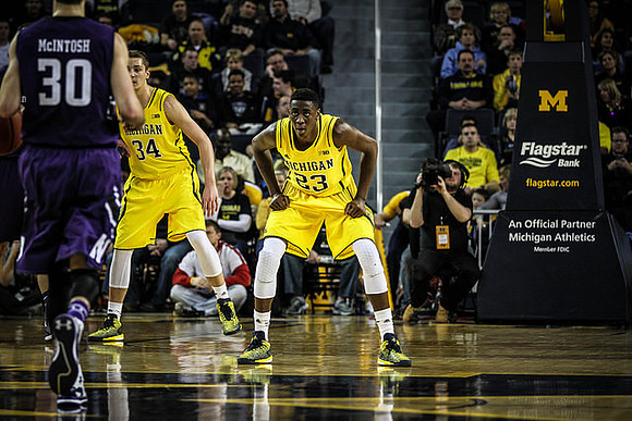 Mark Donnal (34) and Caris LeVert (23)