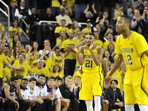 Zak Irvin (21) and Muhammad-Ali Abdur-Rahkman (12)