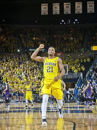 Zak Irvin (21) and Derrick Walton Jr. (10)