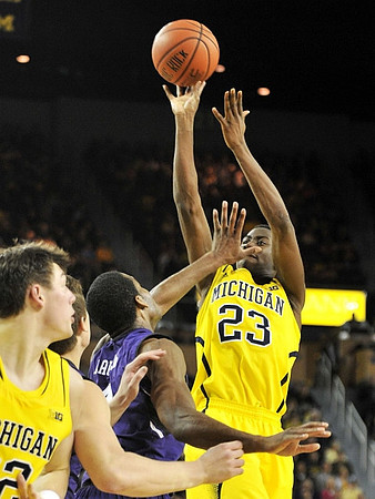 Ricky Doyle (32) and Caris LeVert (23)