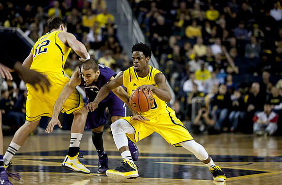 Ricky Doyle (32) and Derrick Walton Jr. (10)