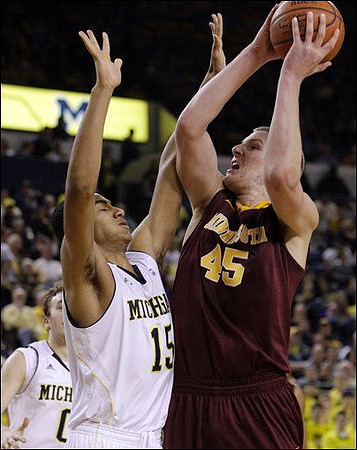 Jon Horford (15) and Zack Novak (0)