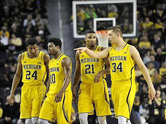 Aubrey Dawkins (24), Derrick Walton Jr. (10), Zak Irvin (21), and Mark Donnal (34)