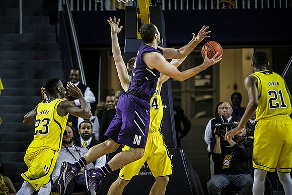 Caris LeVert (23), Max Bielfeldt (44), and Zak Irvin (21)
