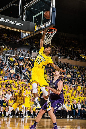 Zak Irvin (21) and Muhammad-Ali Abdur-Rahkman (12)