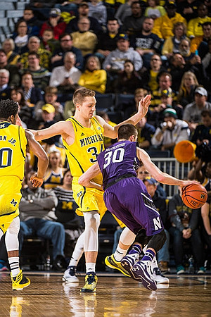 Derrick Walton Jr. (10) and Mark Donnal (34)