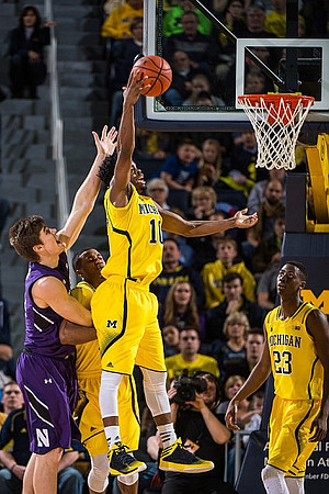 Muhammad-Ali Abdur-Rahkman (12), Derrick Walton Jr. (10), and Caris LeVert (23)